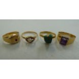 Four variously set gold coloured/yellow metal rings