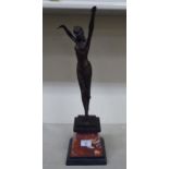 An Art Deco style patinated bronze figure, a female dancer, on a marble and slate effect plinth