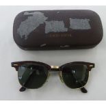 A pair of Bausch & Lomb, Ray-Ban sunglasses (with prescription lenses)