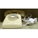 A 2011 GPO cradle type off-white cased telephone handset with a rotary dial