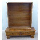 An Art Deco walnut veneered open front bookcase with provision for height adjustable shelves  49"