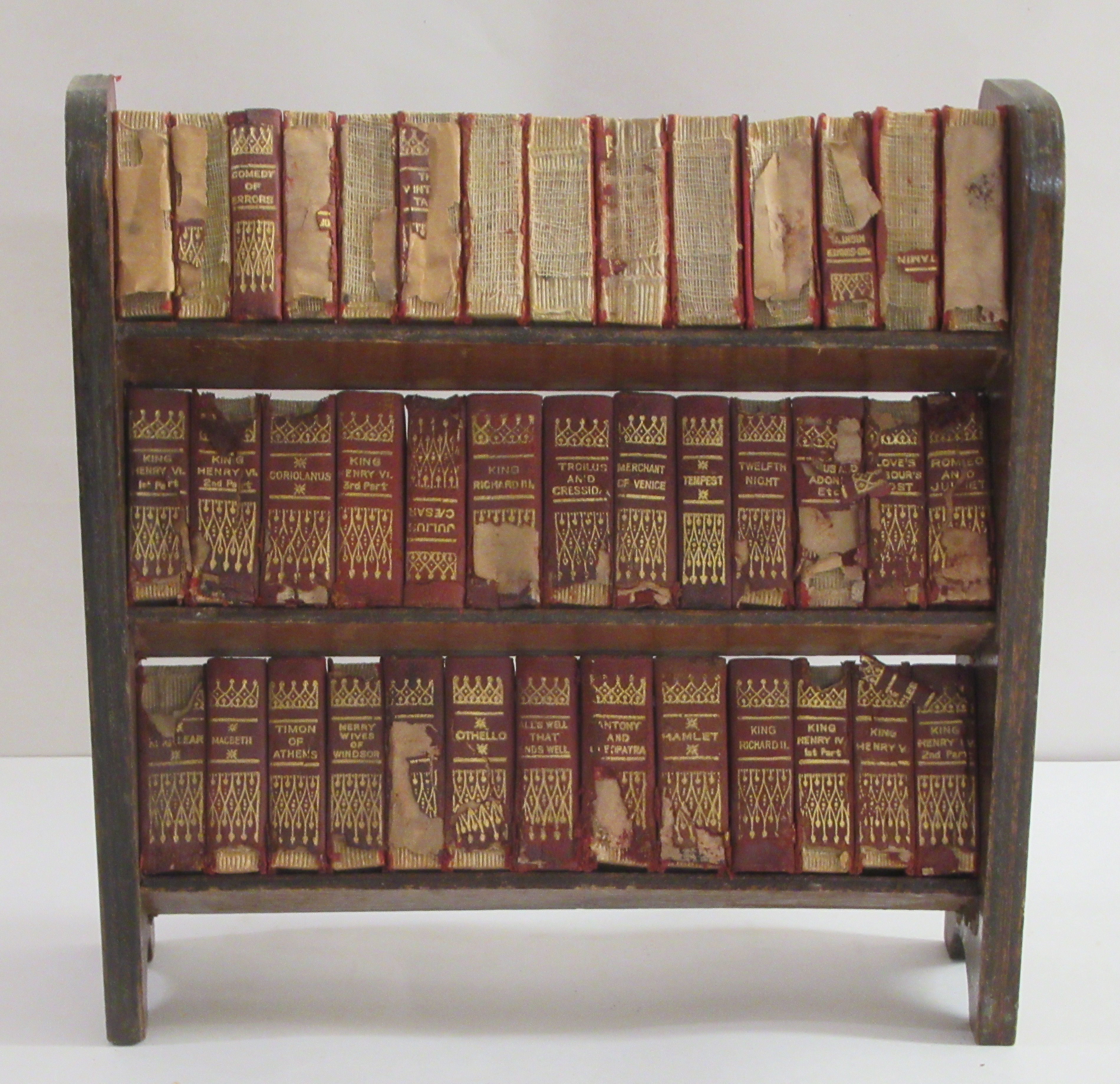 Books: a set of forty miniature volumes of Shakespeare's works, in a dedicated three tier bookcase