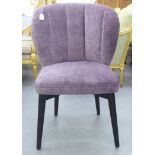 A modern bedroom chair, the shell design with a purple scale effect fabric upholstered back and