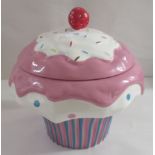 A modern china novelty biscuit jar and cover, fashioned as a 'giant' cupcake  12"h