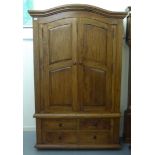 A modern Continental hardwood armoire with an arched cornice, the pair of three-quarter height