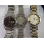 Three stainless steel cased Seiko wristwatches