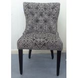 A modern Orior bedroom chair, the two-tone grey/silver fabric upholstered back and seat raised on