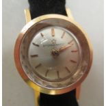 A ladies 18ct gold cased Eterna-Matic wristwatch, faced by a baton dial, on a black hide strap