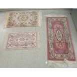 Three similar Chinese washed woollen rugs, decorated in pastel tones  largest 25" x 50"