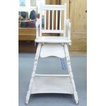 An Edwardian and later painted wooden highchair, the rising tray action top on turned legs, united