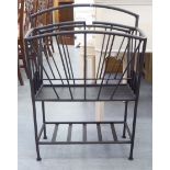 A modern cast metal two division magazine rack, raised on tubular legs  26"h  18"w