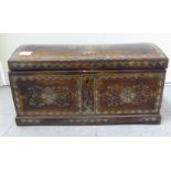 A North African boarded hardwood table casket, decorated with inlaid bone and mother-of-pearl, the