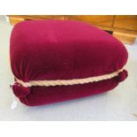 A modern maroon felt effect, fabric upholstered footstool with rope effect trim