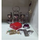 A mixed lot: to include a Japanese Hurman DL-3 silver plated lighter and two silver wine labels on