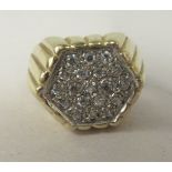 A 9ct gold signet ring, pave set with cubic zirconia