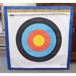 A woven straw archery target  36"sq