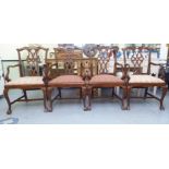 A set of four modern Chippendale design mahogany framed open arm dining chairs with drop-in seats,