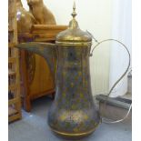 A North African brass floorstanding coffee pot with engraved and coloured enamelled ornament, a