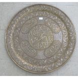 A late 19thC Islamic brass tray, decorated in bi-coloured metal with traditional designs and script