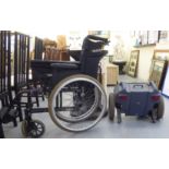 A wheelchair with a battery powered attachment
