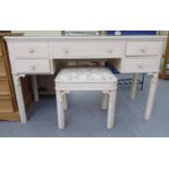 A modern cream painted five drawer dressing table, raised on square, splayed legs  29"h  48"w