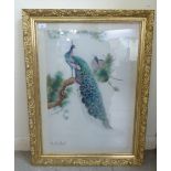 A modern Oriental embroidered, coloured silk picture, depicting peacocks  bears a signature  24" x