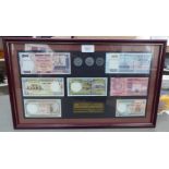 A uncirculated presentation set of Bangladeshi banknotes and coins  9" x 16"  framed