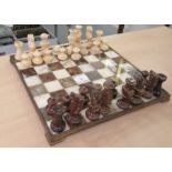An Italian two tone marble chess set (complete), the brass mounted board  13"sq
