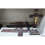 Five dissimilar crucifix, one on a stepped block stand  14"h