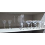 A set of eleven clear stemmed glass Champagne glasses cut floral decoration