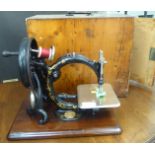 A vintage Willcox & Gibbs manual sewing machine, made in USA  cased