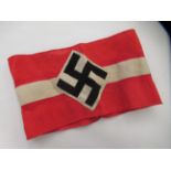 A German military red fabric armband  bearing a swastika emblem (Please Note: this lot is subject to