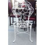 A modern white wrought wire framed terrace chair