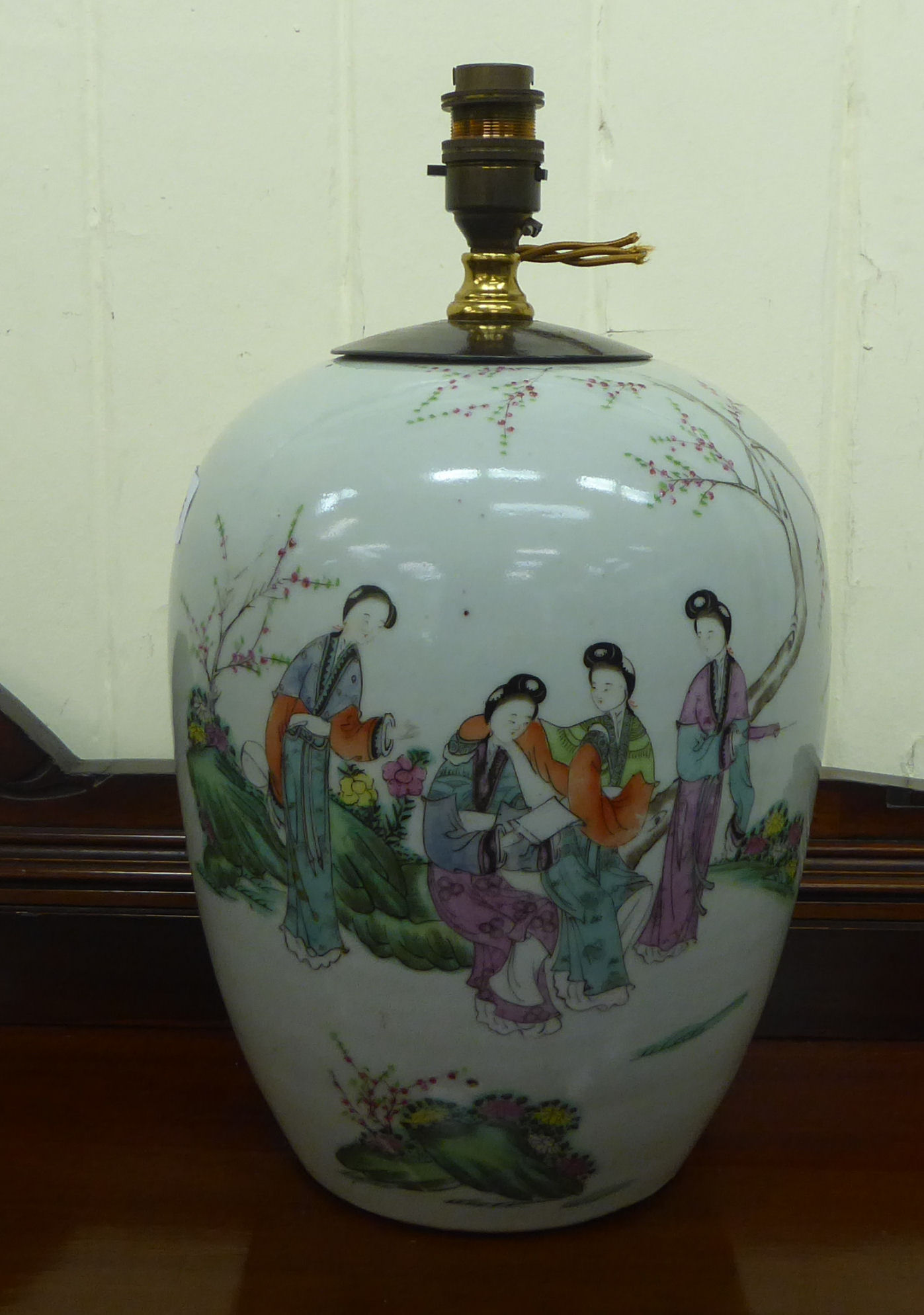 A late 19thC Chinese porcelain vase, converted to a lamp, decorated with female figures, in a garden