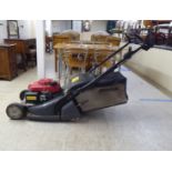 A Honda Easy-Start HRX-476 petrol driven lawnmower with a 14"dia cut and a grass box