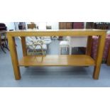 A modern light oak serving table, the top cut with geometric motifs, raised on block legs  36"h