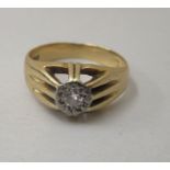 An 18ct gold Gypsy ring, set with a central diamond