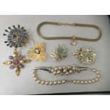 Designer costume jewellery: to include a Paris House star brooch, set with semi precious stones
