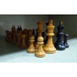 A boxwood and ebonised turned and carved chess set, the kings  2.75"h  boxed