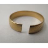 A 22ct gold wedding ring (cut)