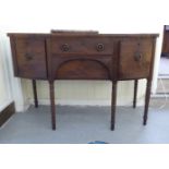 A Regency mahogany bow front sideboard with two drawers and two doors, raised on turned legs  36"