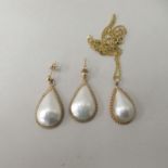 A Mabe pearl pendant necklace; and matching earrings