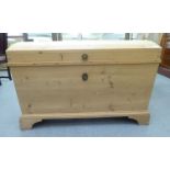 A late Victorian pine dome top trunk with angled sides, raised on bracket feet  31"h  45"w  25"deep