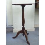 A late Victorian mahogany pedestal table, the top with a guilloche pierced and carved border, over a