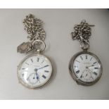A silver cased pocket watch with engine turned decoration, the keyless movement faced by a Roman