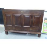 An early 19thC country made oak chest with a hinged lid and straight sides and a quadruple