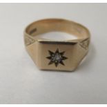 A 9ct gold signet ring, set with a diamond