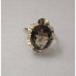A 9ct gold ring, set with a central smokey quartz