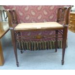 An Edwardian mahogany framed and marquetry piano stool with pierced flank splats and an