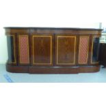 A modern reproduction of a crossbanded satinwood and faux rosewood finished sideboard with a pair of